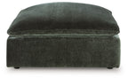 Jade green upholstered accent ottoman with rounded top and cushioned base