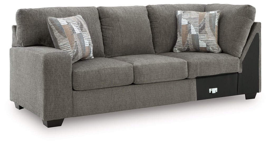 Greystone gray LAF sofa with corner wedge, three seat cushions, and two accent pillows