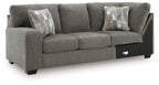 Greystone gray LAF sofa with corner wedge, three seat cushions, and two accent pillows