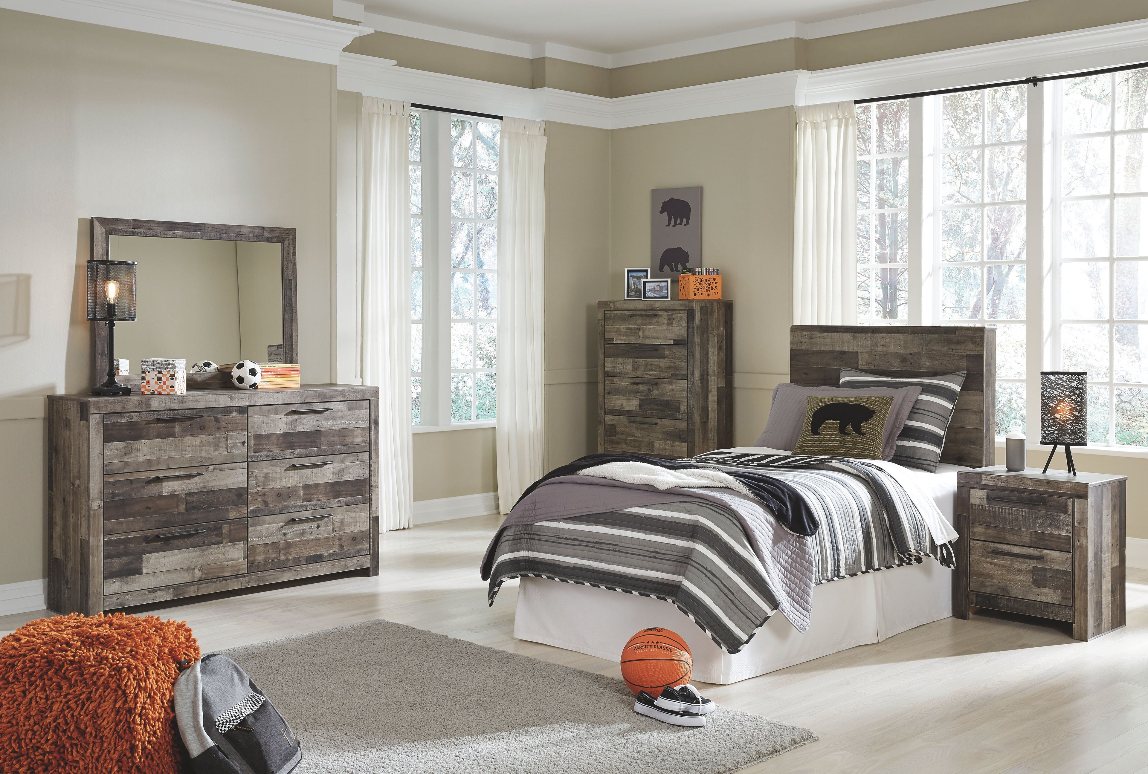 Dark gray bed frame with headboard and striped blanket, gray pillow accents