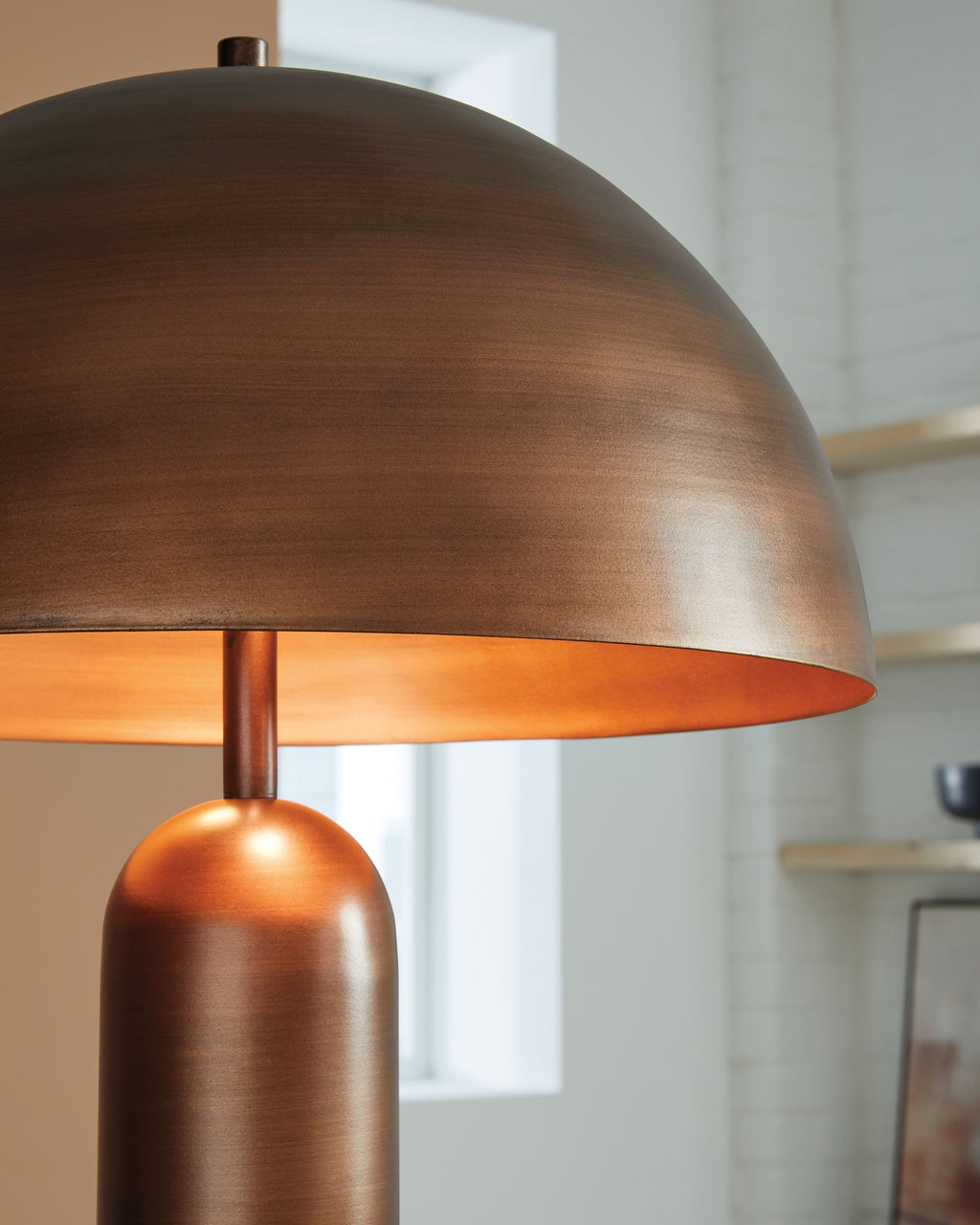 Metal dome shade lamp with bronze finish and cylindrical stem