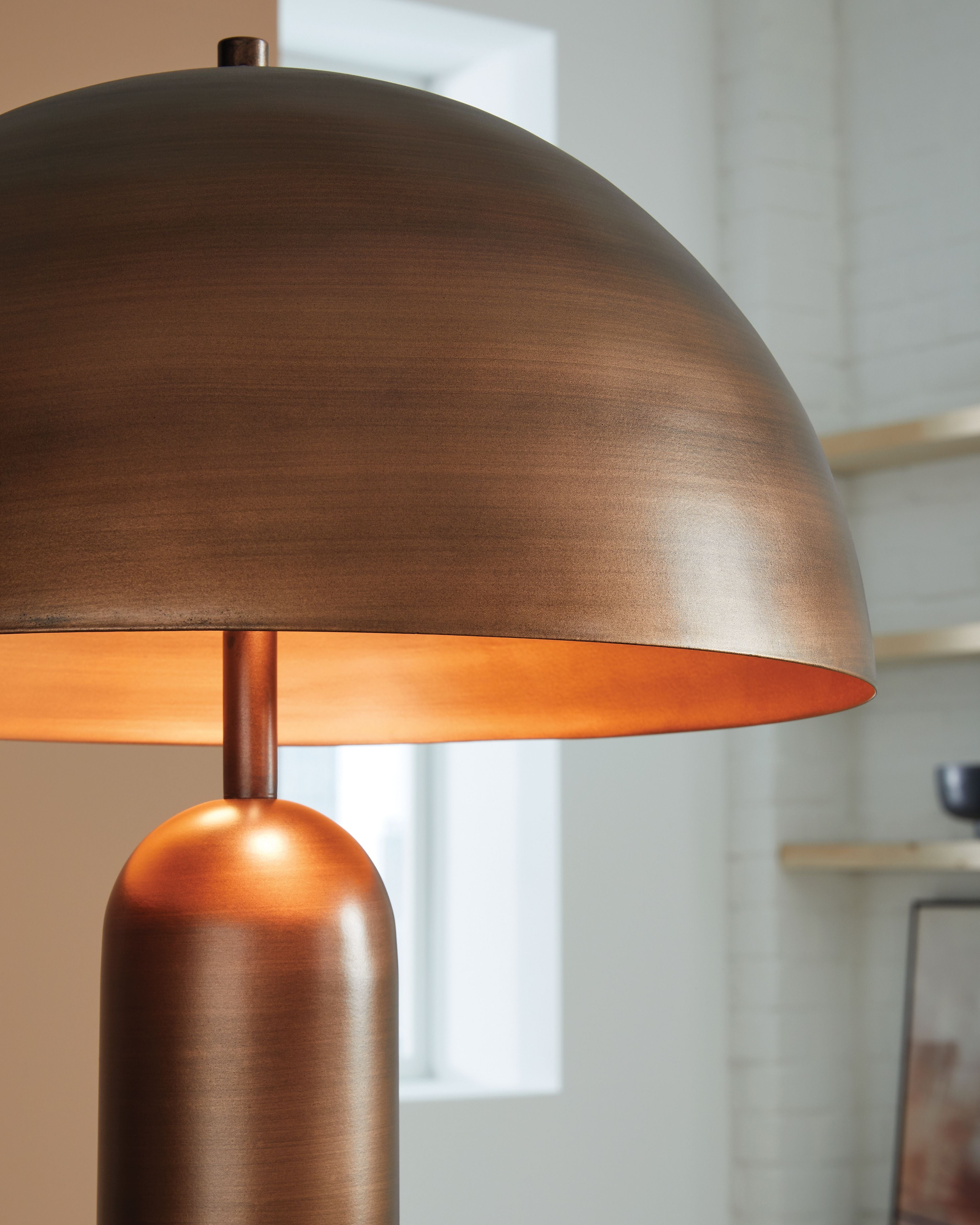 Metal dome shade lamp with bronze finish and cylindrical stem
