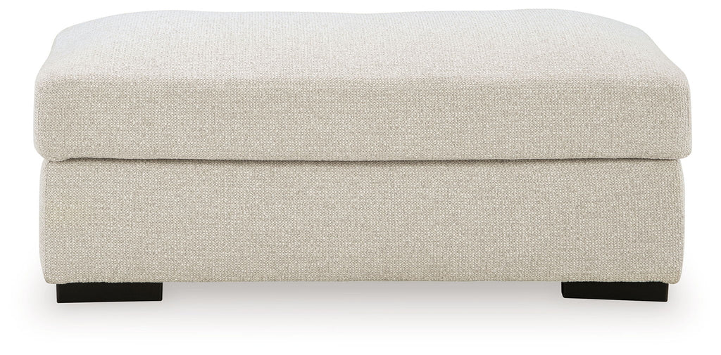 Square light beige linen ottoman with rounded top and dark legs