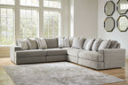 Gray sectional sofa with chaise corner and neatly arranged striped throw pillows