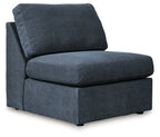 Blue sectional chair with tall backrest cushion and squared base legs