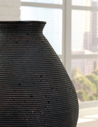 Dark brown ceramic vase with ribbed texture and rounded shoulder
