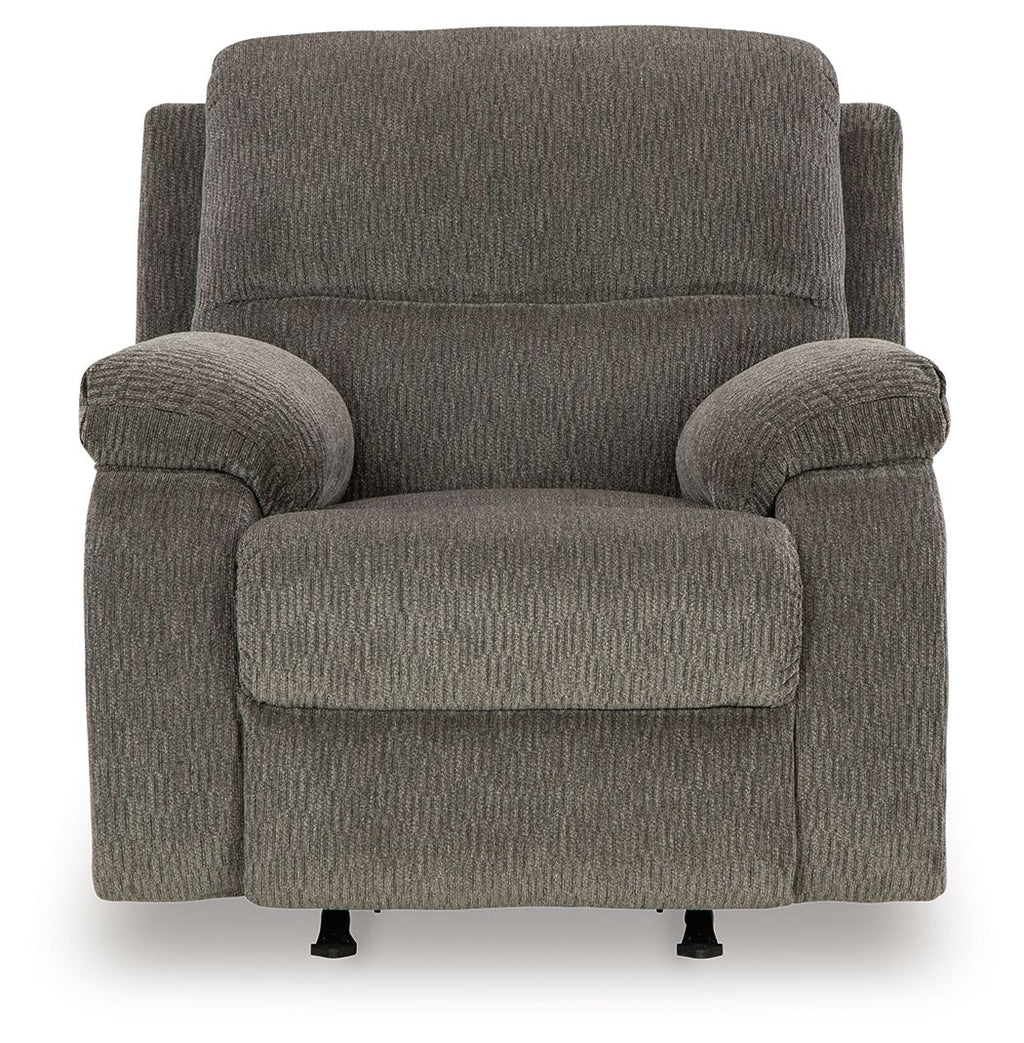 Dark gray rocker recliner chair with wide padded arms and recline-ready seat
