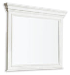 Whitewash bedroom mirror with rectangular frame and flat top molding