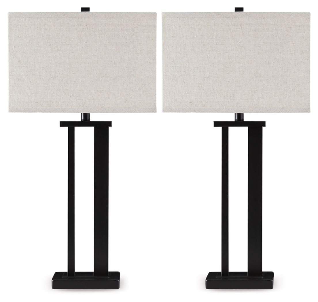 Black metal table lamp with beige fabric shade and pedestal base