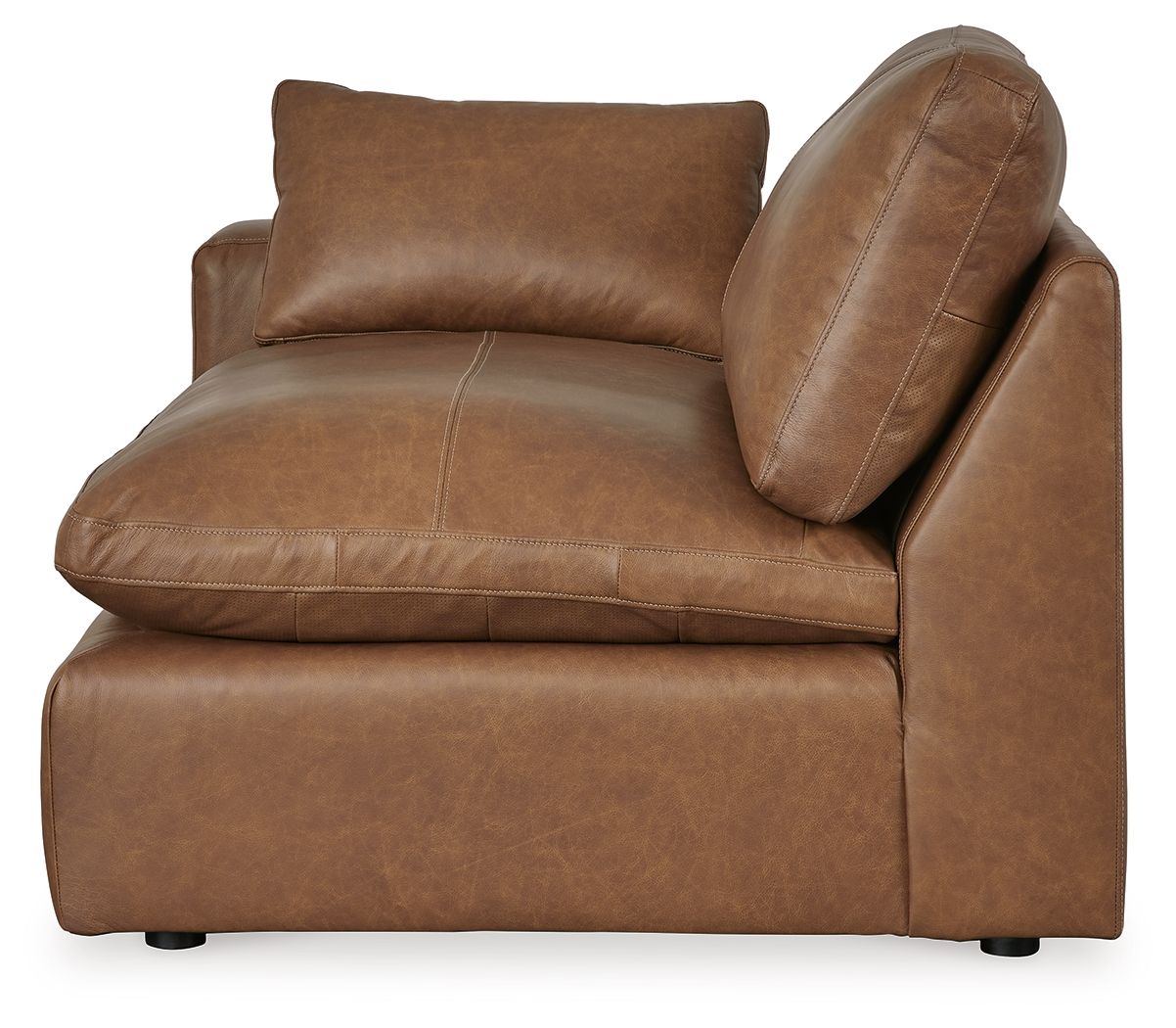 Caramel brown armchair with rounded side panel, cushioned backrest, and angled arm detail.