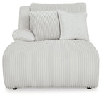Press-back chaise seat with light-gray ribbed upholstery and back bolster pillows