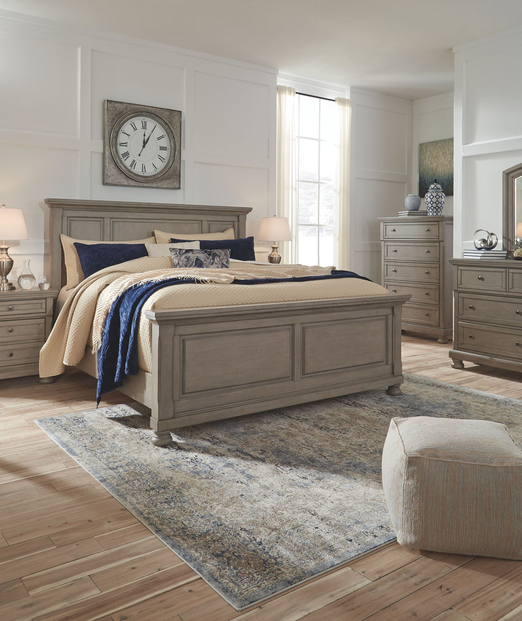 Gray panel bedroom bed with footboard and rails, styled with blue and cream bedding