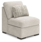 Light gray armless chair with textured upholstery, patterned back pillow, and dark legs