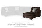 Chocolate brown corner chaise sofa with rounded arm, block feet, and geometric cushion