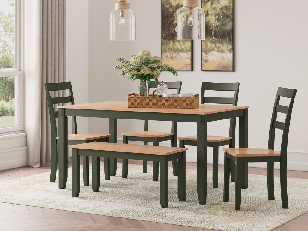 Dining table with dark green chairs and dark wood tabletop