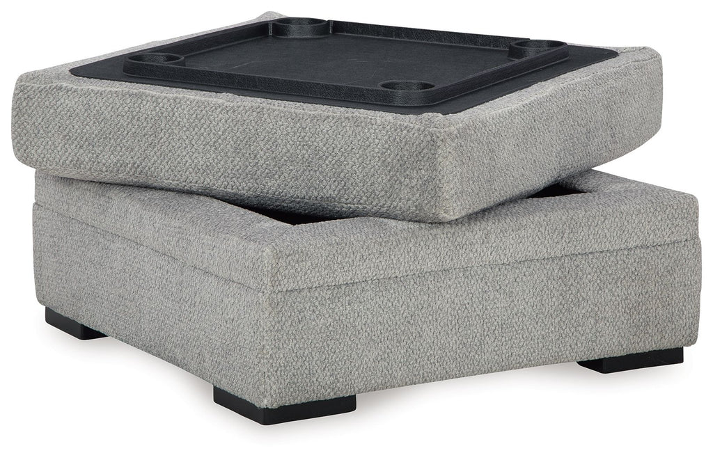 Cement gray storage ottoman with open lid and dark interior tray