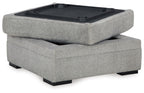 Cement gray storage ottoman with open lid and dark interior tray