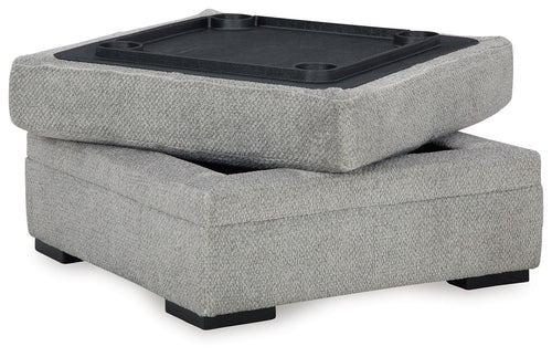 Cement gray storage ottoman with open lid and dark interior tray