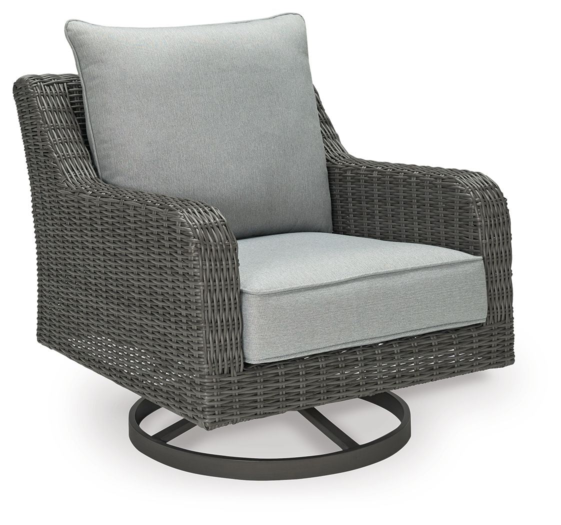 Gray swivel lounge chair with light gray seat cushion and dark woven wicker sides
