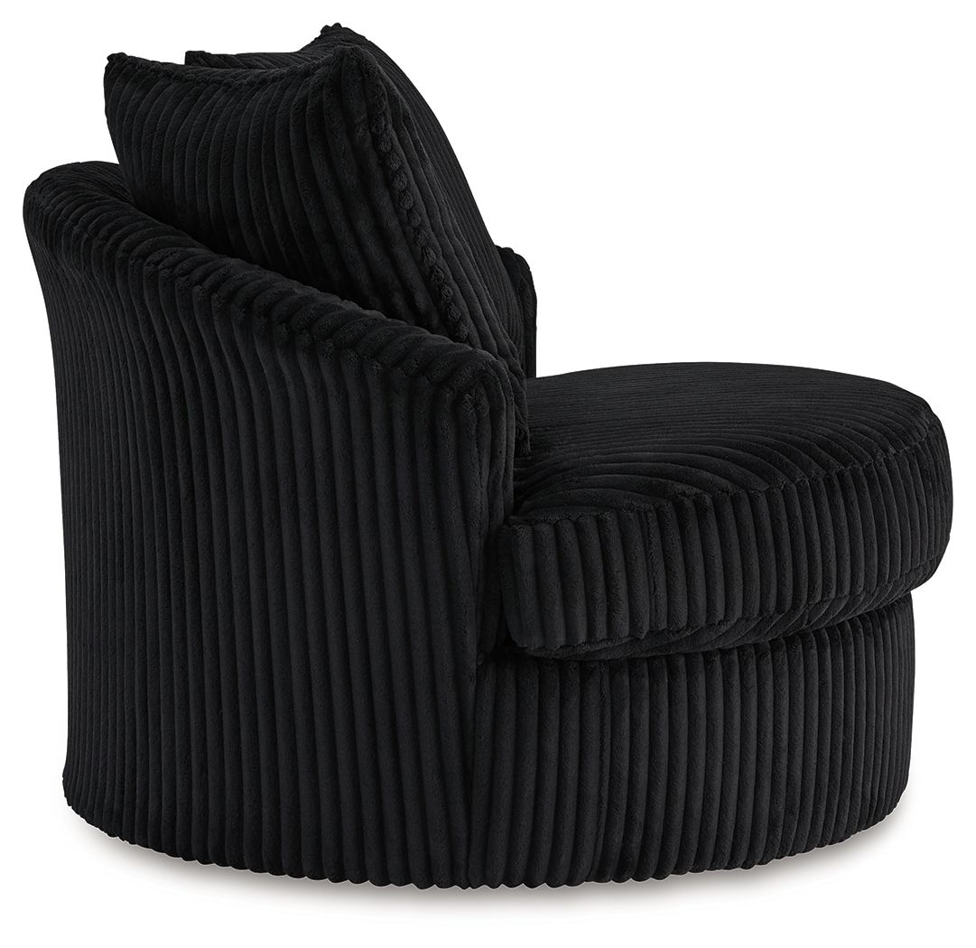 Swivel chair in dark ribbed upholstery with curved armrests and two back cushions