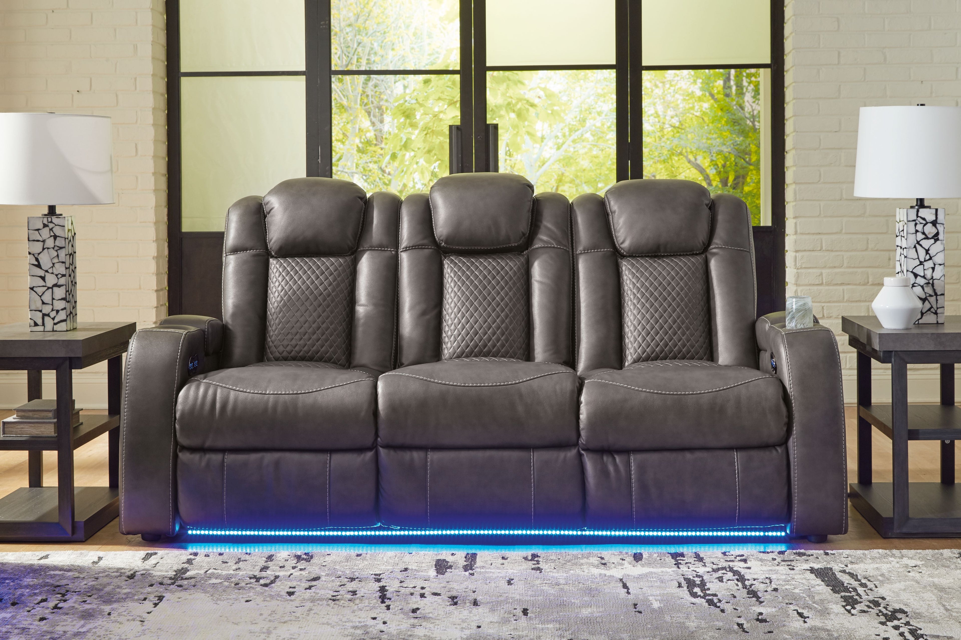 Power reclining sofa with adjustable headrests, gray leather-look upholstery