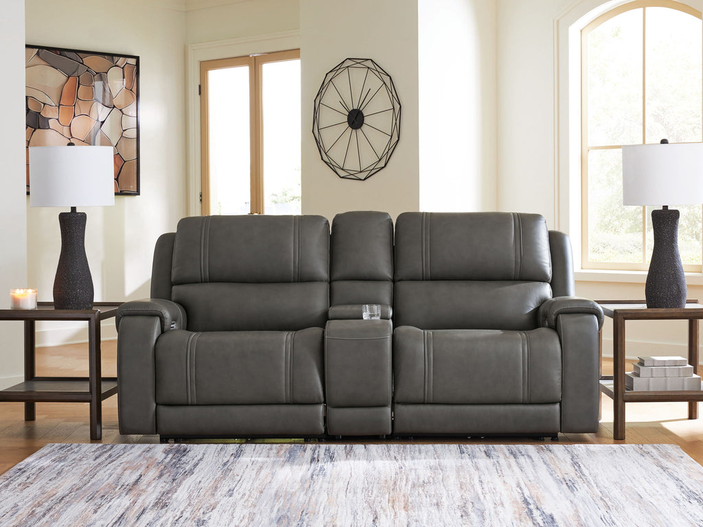 Dark gray reclining sectional with padded arms, segmented back cushions, and recline panels