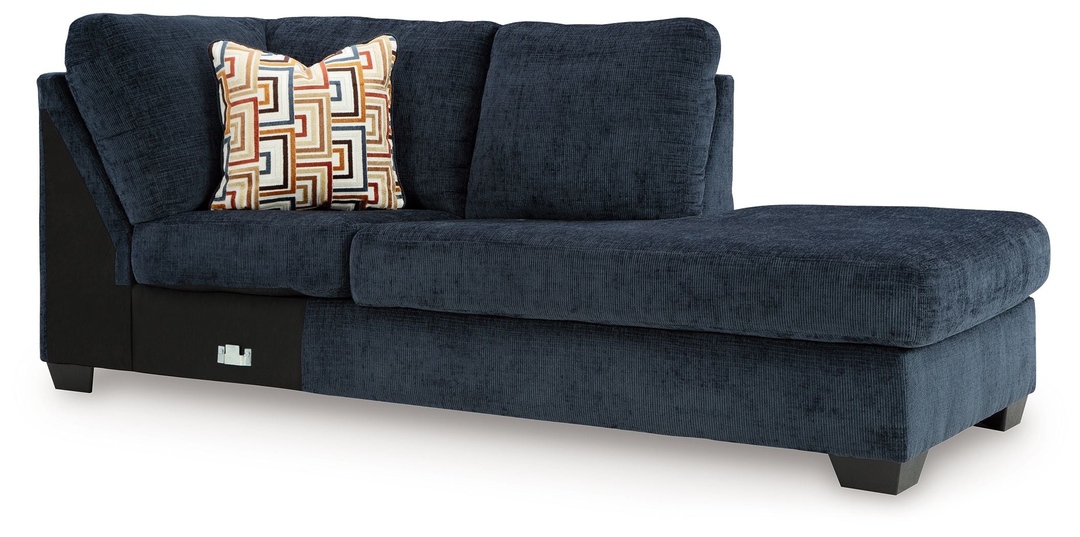 Ink blue corner chaise sofa with patterned throw pillow and dark legs