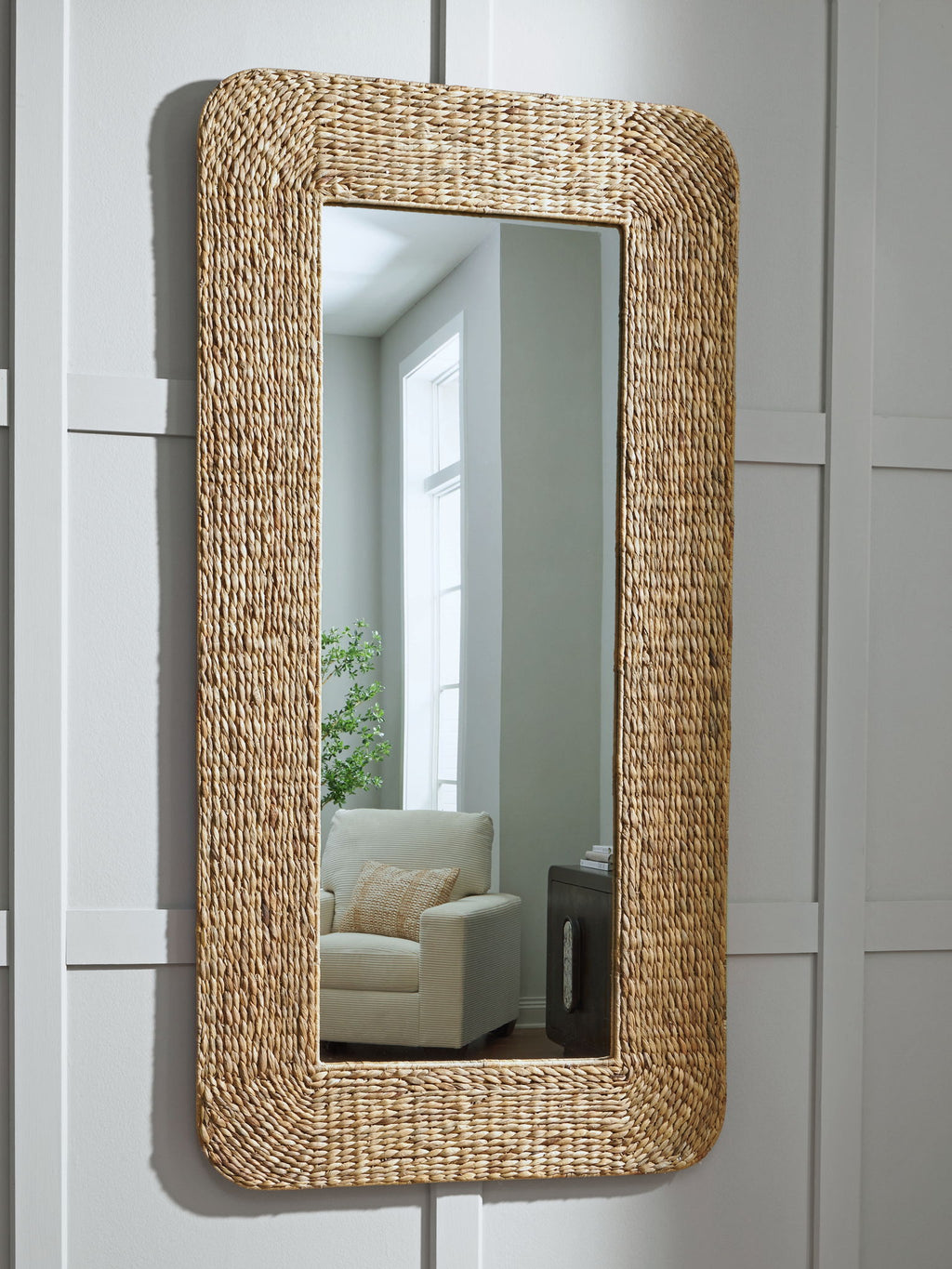 Natural woven floor mirror with rounded rectangular frame, full-length