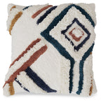 Evermore pillow cover with fuzzy white front and geometric embroidery in dark blue and rust
