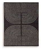 Eldonmore rug in black with white concentric line art pattern.