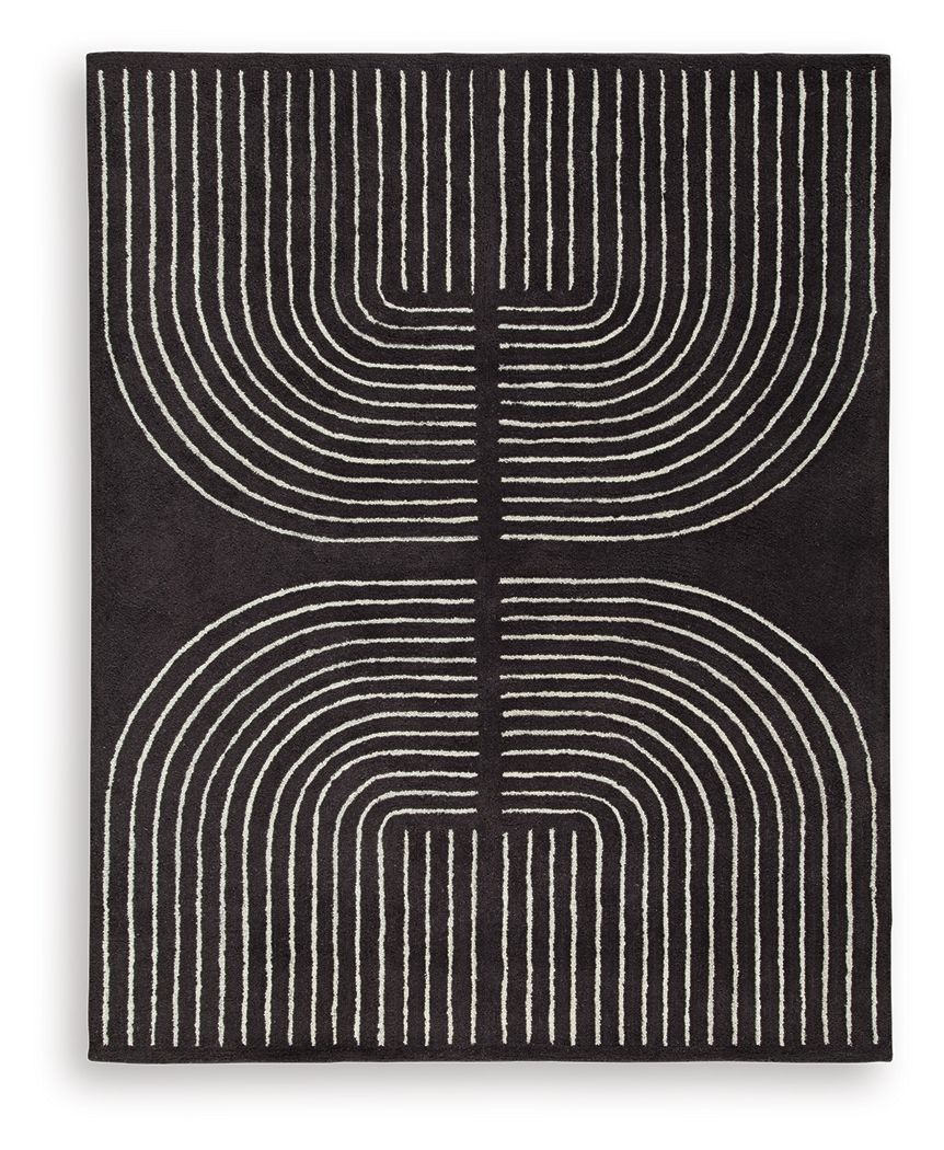 Eldonmore rug in black with white concentric line art pattern.