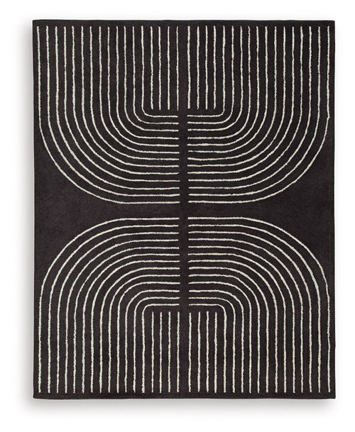 Eldonmore rug in black with white concentric line art pattern.