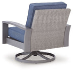 Blue cushioned swivel lounge chair with woven sides and gray frame, round rotating base