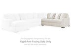 Ivory sectional sofa with right-facing chaise section and loose seat cushions
