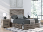 Dark gray panel bed with storage drawers, styled with gray bedding