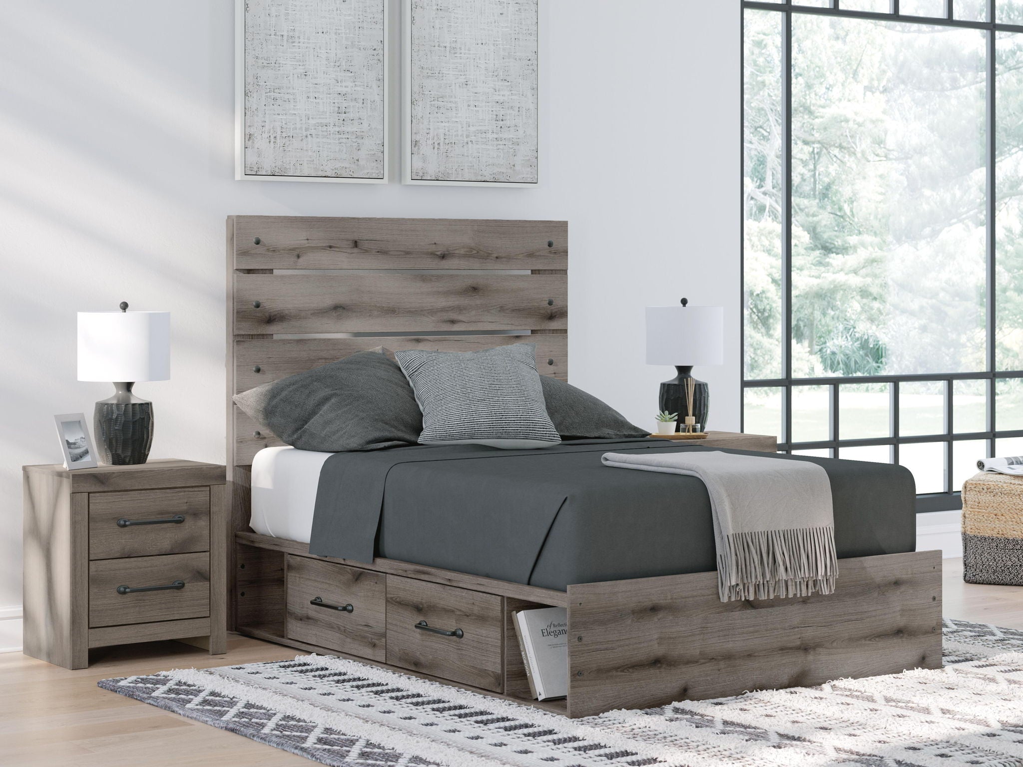 Dark gray panel bed with storage drawers, styled with gray bedding