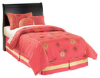 Black youth sleigh headboard with smooth arched silhouette on bed