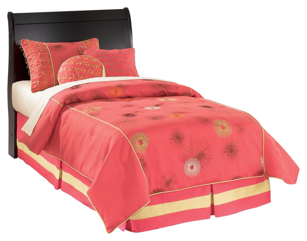Black youth sleigh headboard with smooth arched silhouette on bed