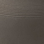 Dalsen vase surface close-up: dark brown stoneware texture with fine horizontal lines.
