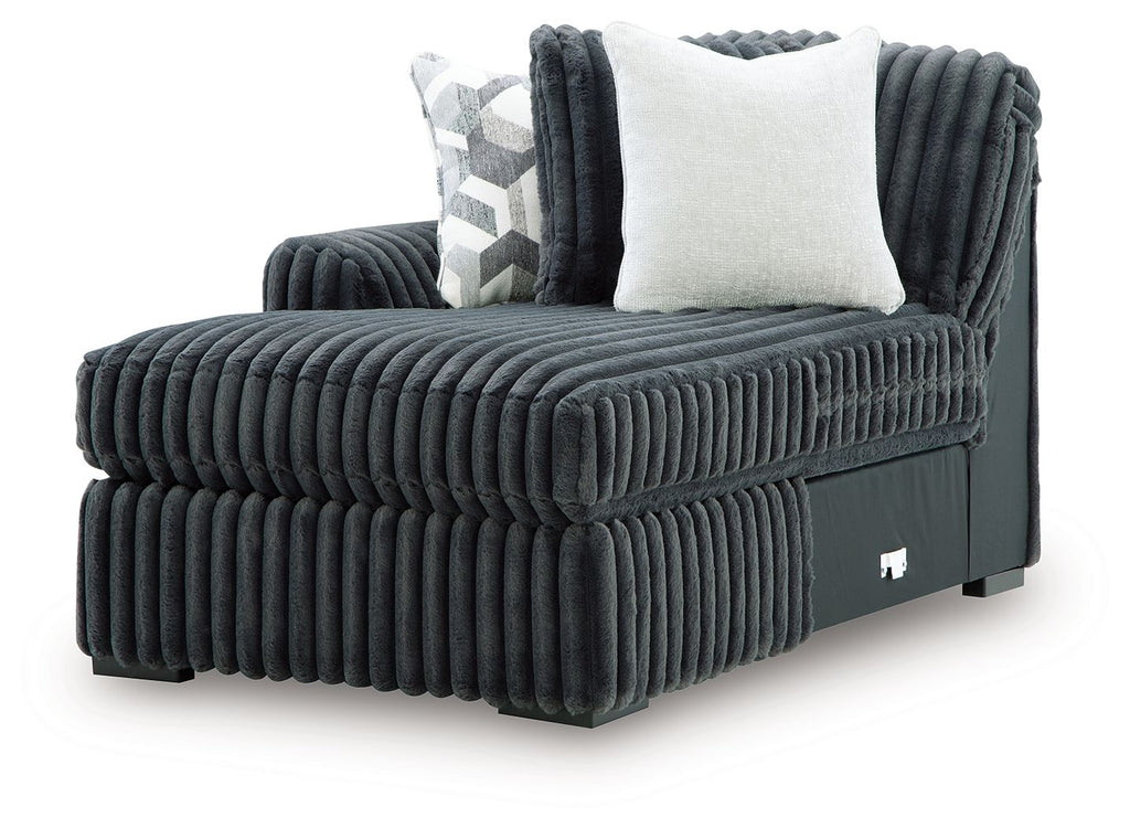 Gunmetal corduroy corner chaise with square arm, plush cushions, and light throw pillow