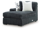 Gunmetal corduroy corner chaise with square arm, plush cushions, and light throw pillow