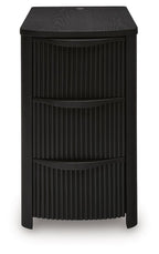 Black chair side end table with vertical slat panels and three drawer compartments