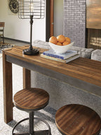 Dark brown counter table with round stool seats and black metal bases