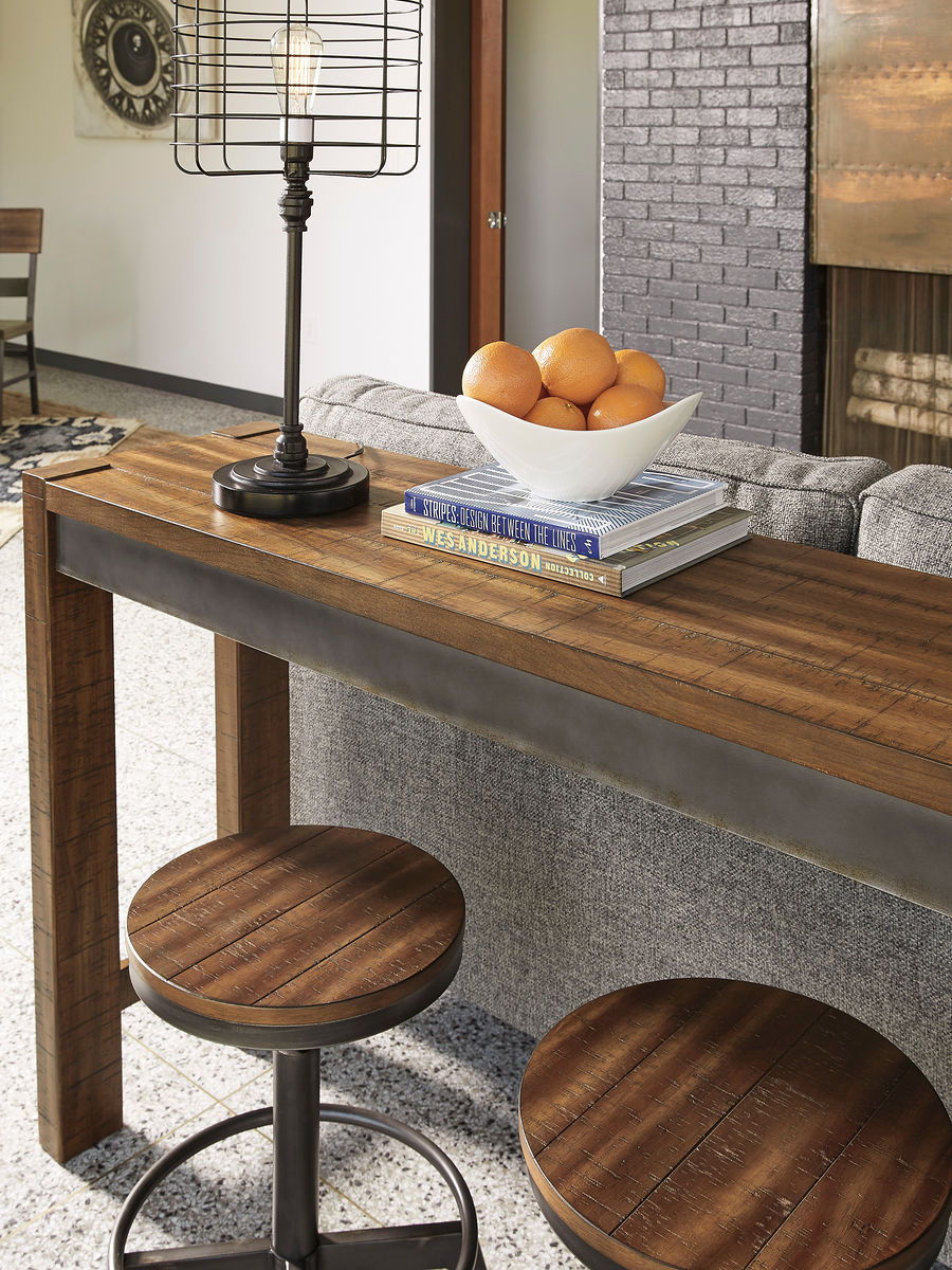 Dark brown counter table with round stool seats and black metal bases