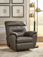 Dark gray rocker recliner with padded arms, recline seat, and stitched seams