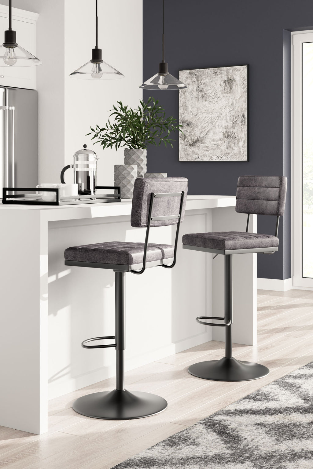 Set of 2 tall swivel barstools, dark gray fabric seats, round metal bases.