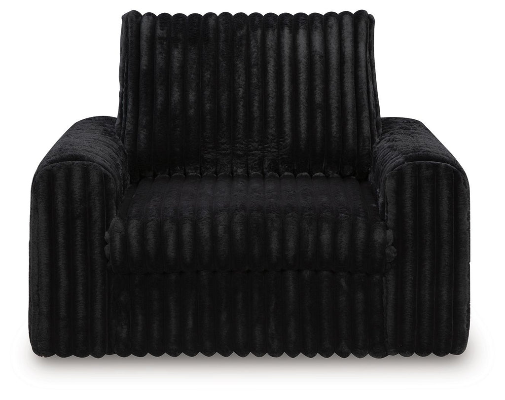 Onyx corduroy power gliding chaise with tufted seat and tall backrest.