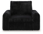Onyx corduroy power gliding chaise with tufted seat and tall backrest.