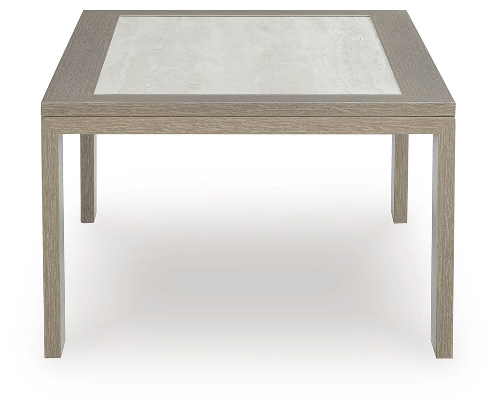 Beige square coffee table with inset light top and straight legs