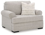 Gray fabric accent chair with wide seat and patterned lumbar pillow